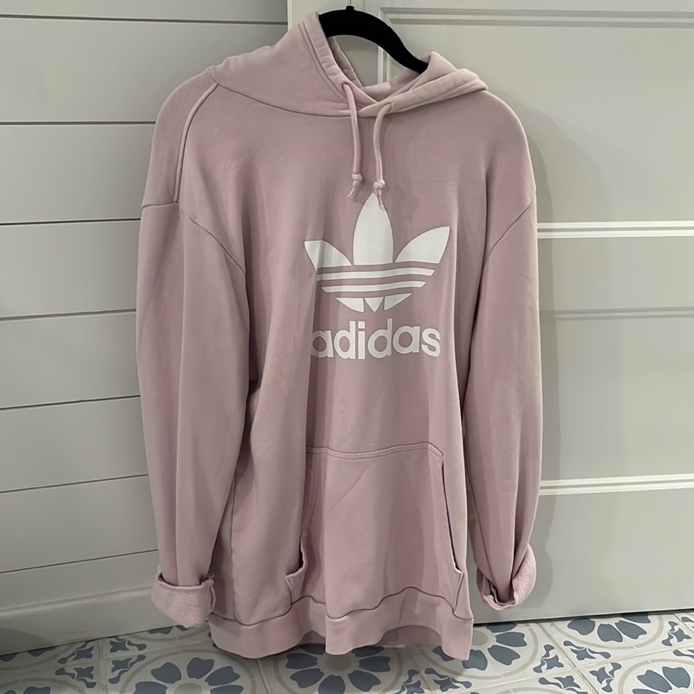 Large pink adidas sweatshirt.